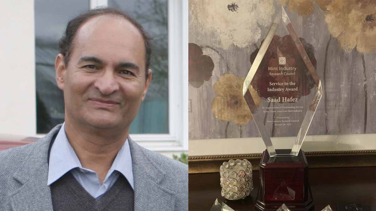Portrait of a man with an award.